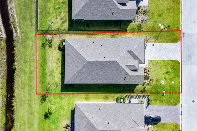 an aerial view of a house with a garden