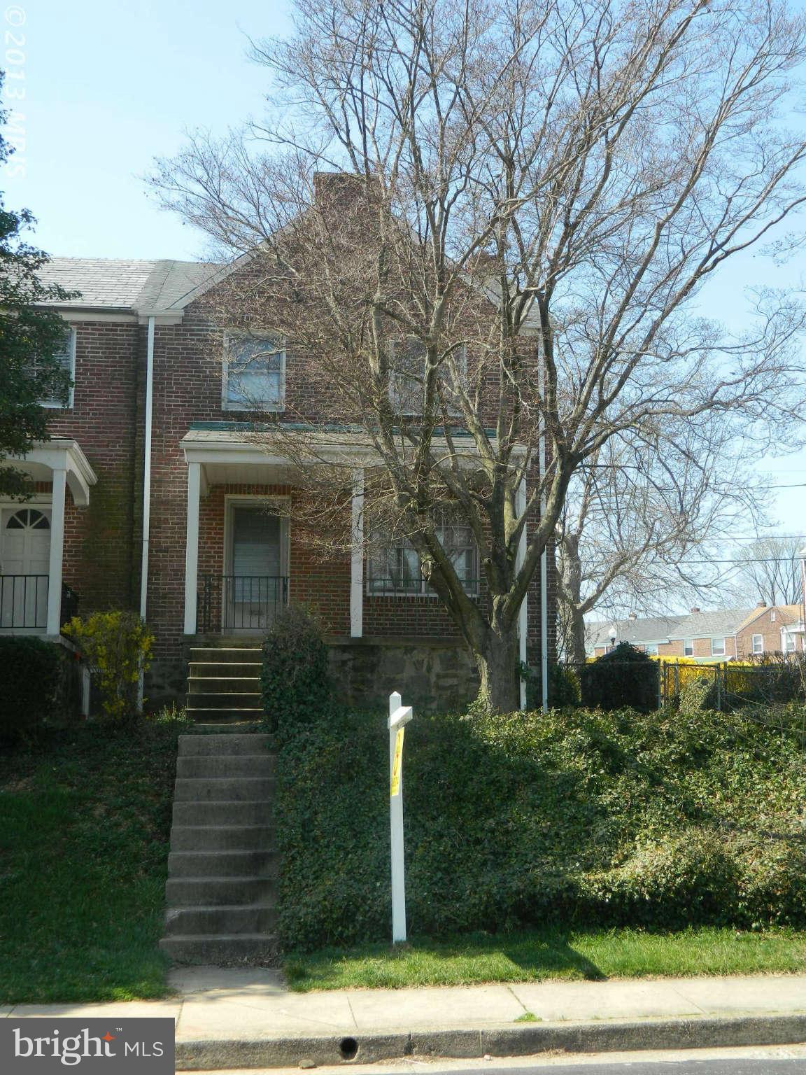 3834 Monterey Road Baltimore, MD 21218 - Photo 3 of 26 a front view of a house with garden