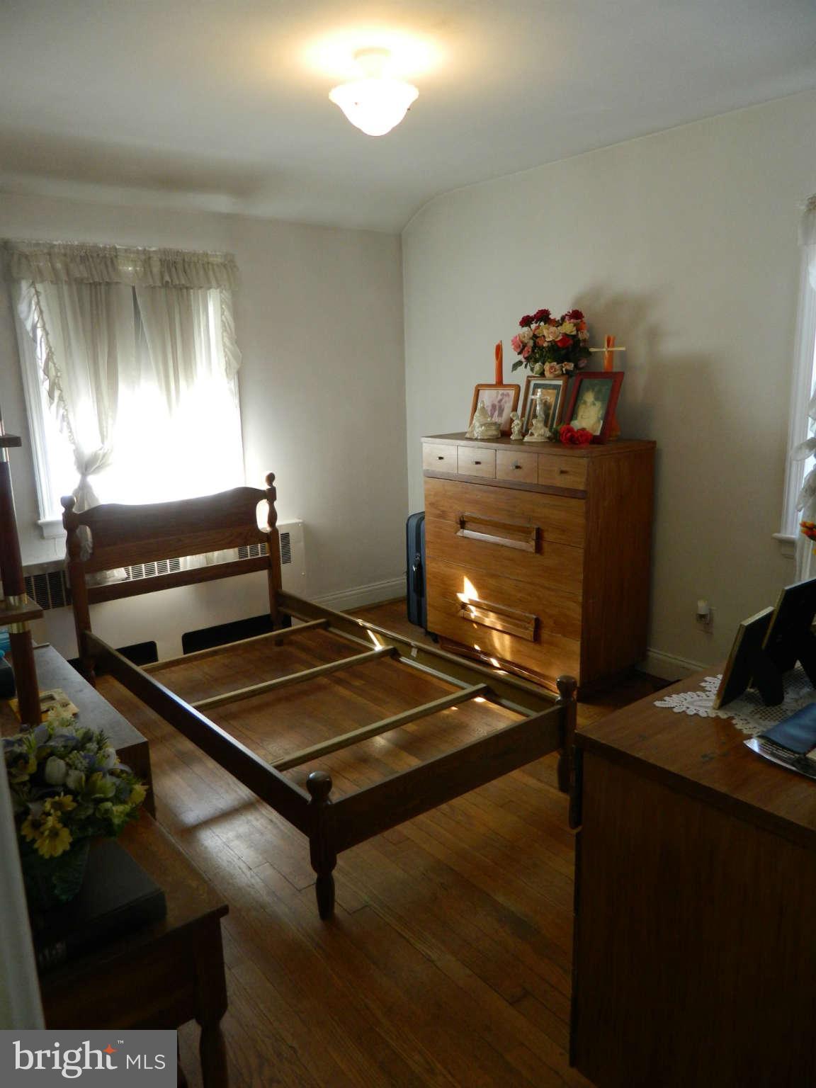 3834 Monterey Road Baltimore, MD 21218 - Photo 23 of 26 a room with furniture and window