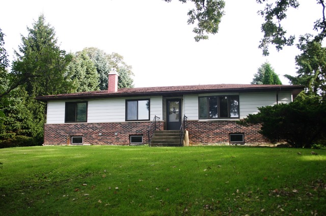 18108 Altenburg Road Harvard, IL 60033 - Photo 3 of 12 a front view of house with a yard and green space