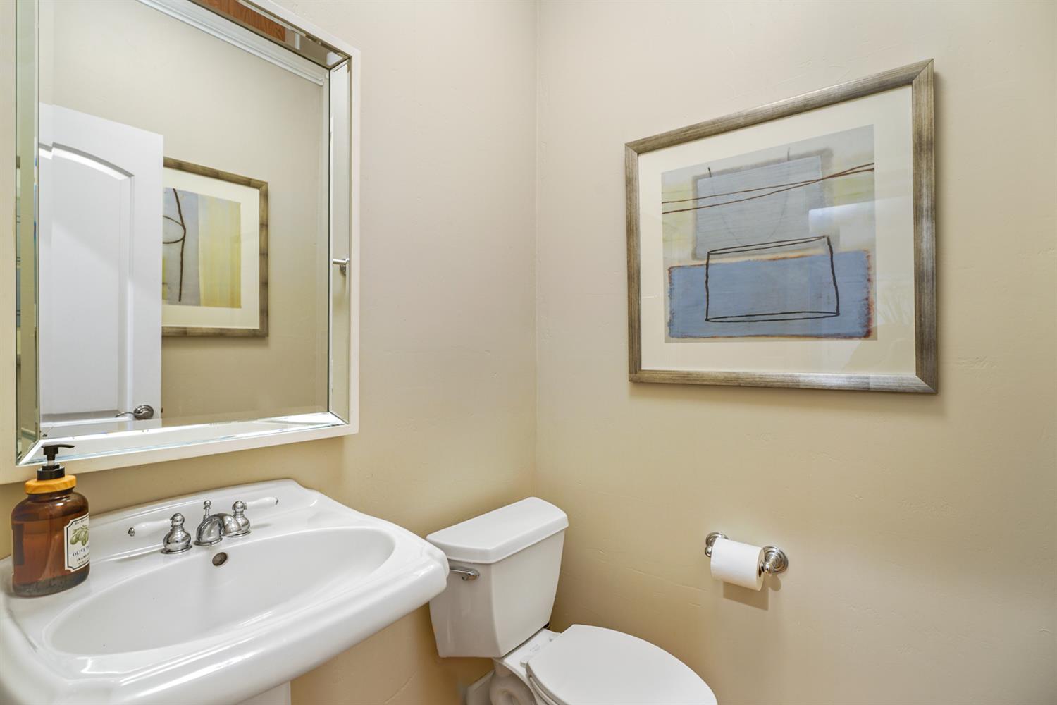 5512 Riviera Granite Bay, CA 95746 - Photo 16 of 76 a white toilet sitting next to a bathroom sink