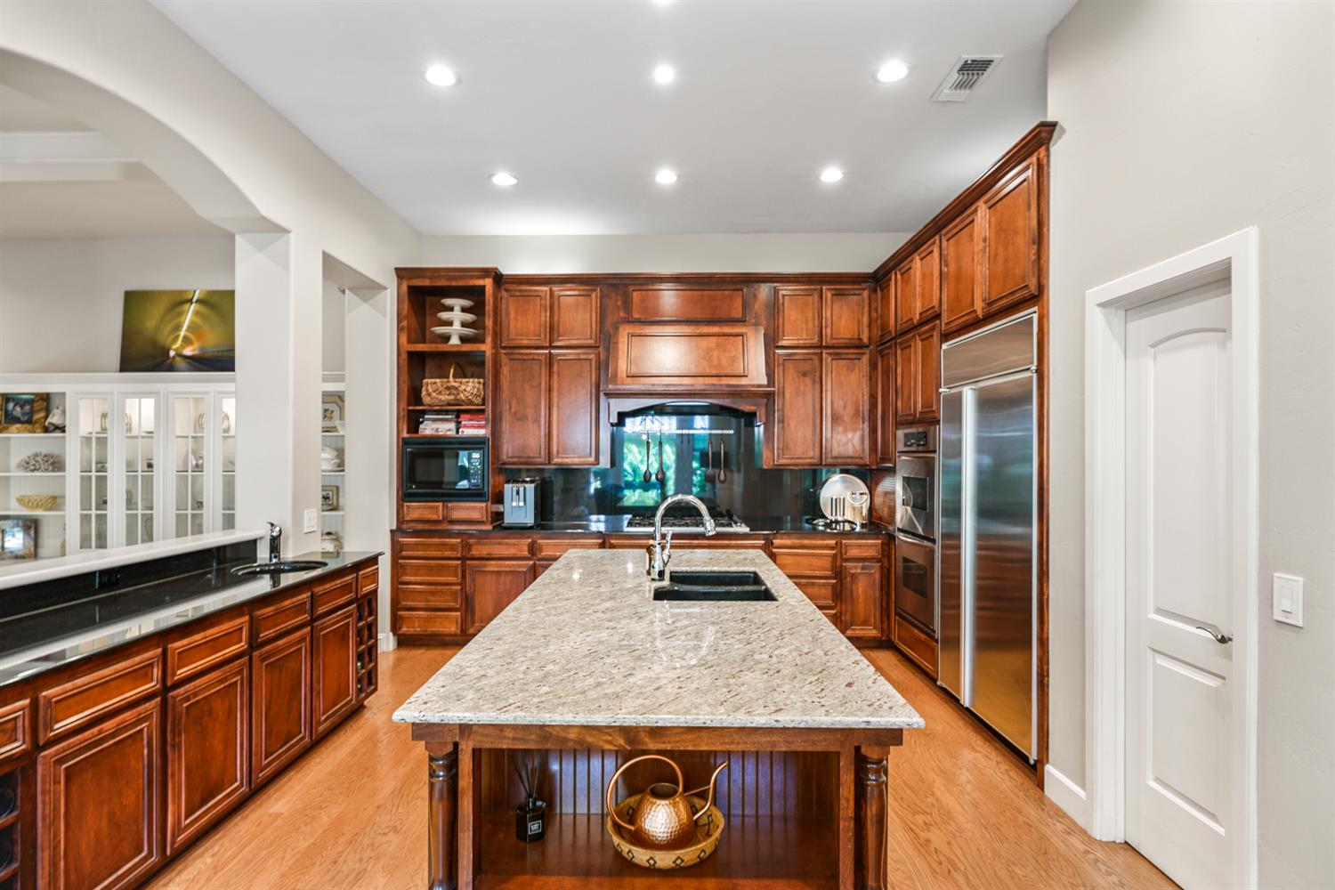 5512 Riviera Granite Bay, CA 95746 - Photo 18 of 76 a kitchen with stainless steel appliances granite countertop sink stove and refrigerator