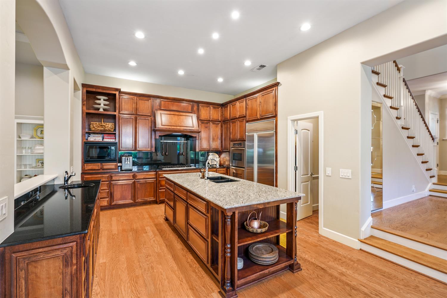 5512 Riviera Granite Bay, CA 95746 - Photo 19 of 76 a large kitchen with stainless steel appliances granite countertop a large counter top and a stove