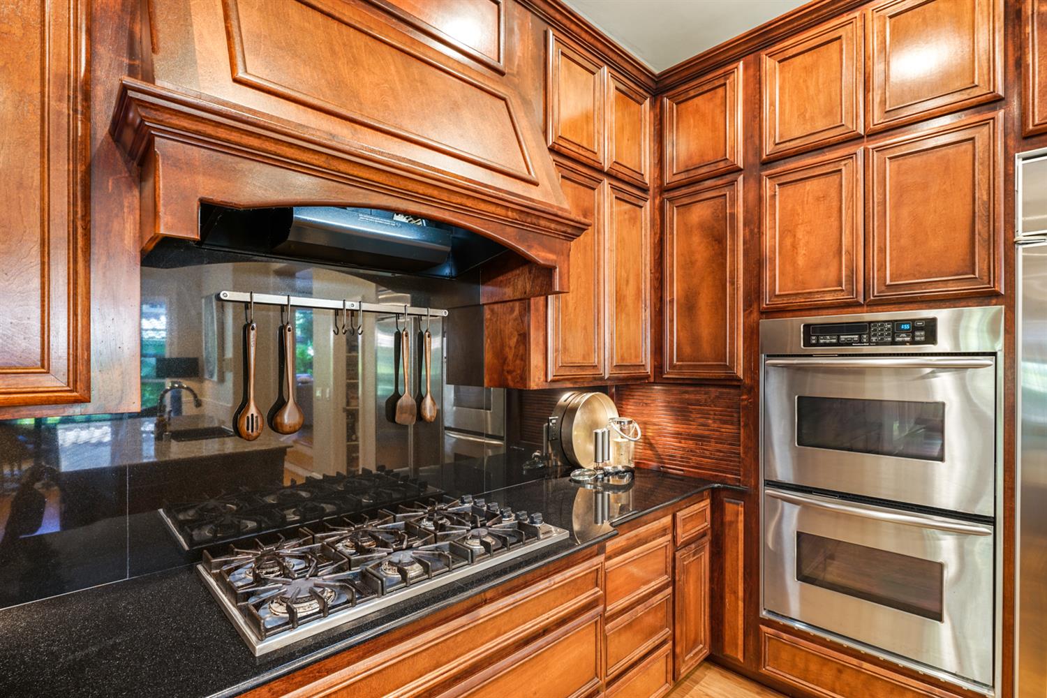 5512 Riviera Granite Bay, CA 95746 - Photo 20 of 76 a kitchen with stainless steel appliances granite countertop a stove and a refrigerator