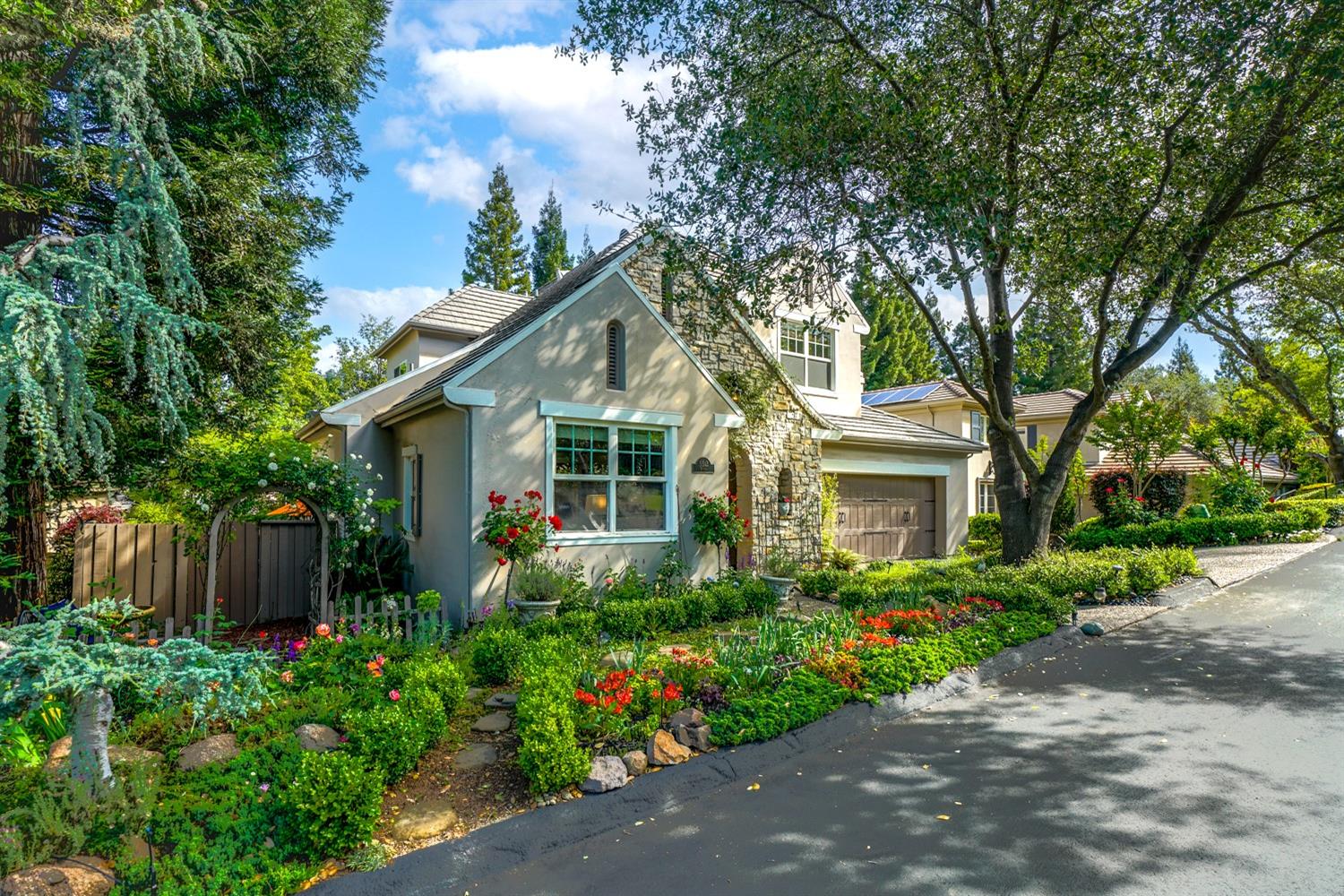 5512 Riviera Granite Bay, CA 95746 - Photo 2 of 76 a front view of a house with a yard and potted plants