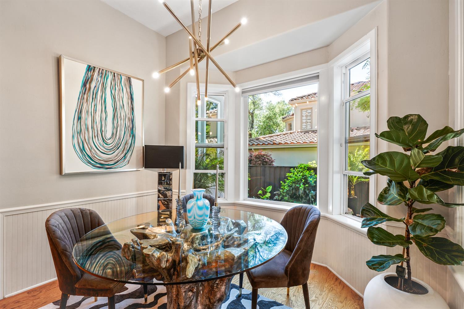 5512 Riviera Granite Bay, CA 95746 - Photo 24 of 76 a dining room with furniture a potted plant and a chandelier