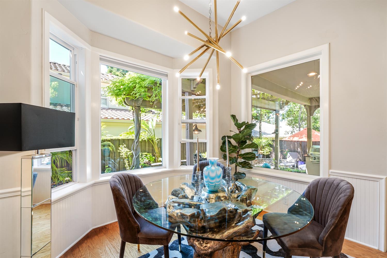 5512 Riviera Granite Bay, CA 95746 - Photo 25 of 76 a dining room with furniture a chandelier and wooden floor
