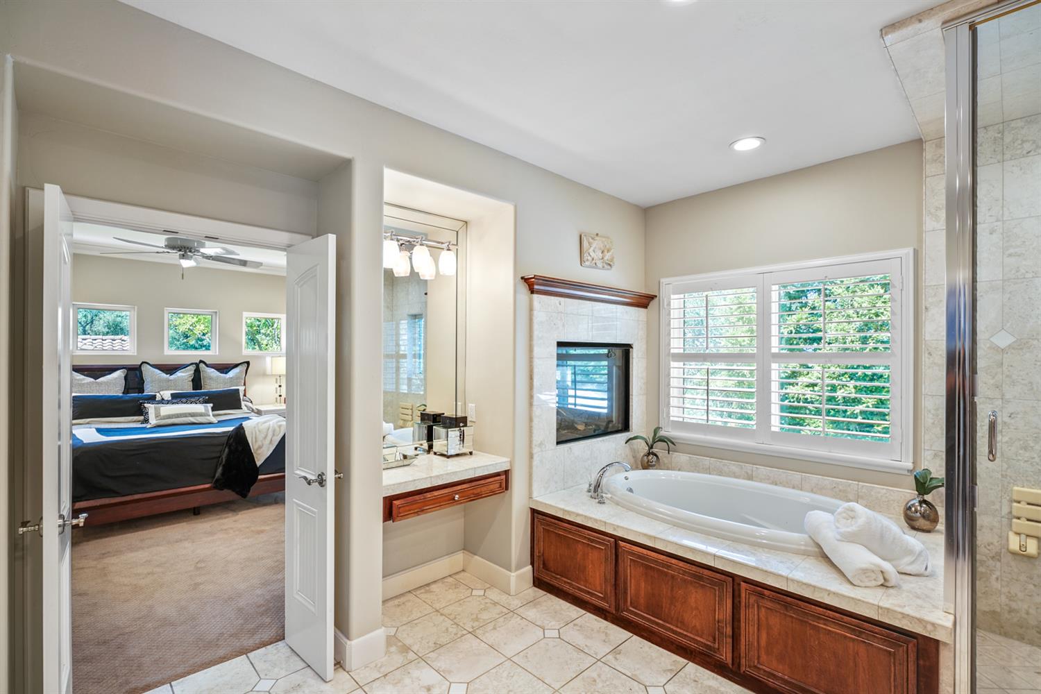 5512 Riviera Granite Bay, CA 95746 - Photo 44 of 76 a spacious bathroom with a granite countertop tub shower and mirror
