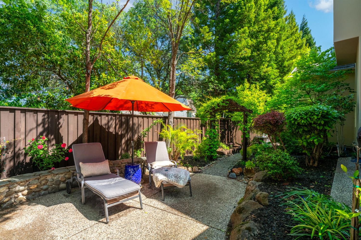 5512 Riviera Granite Bay, CA 95746 - Photo 61 of 76 a chair and tables in the patio with potted plants