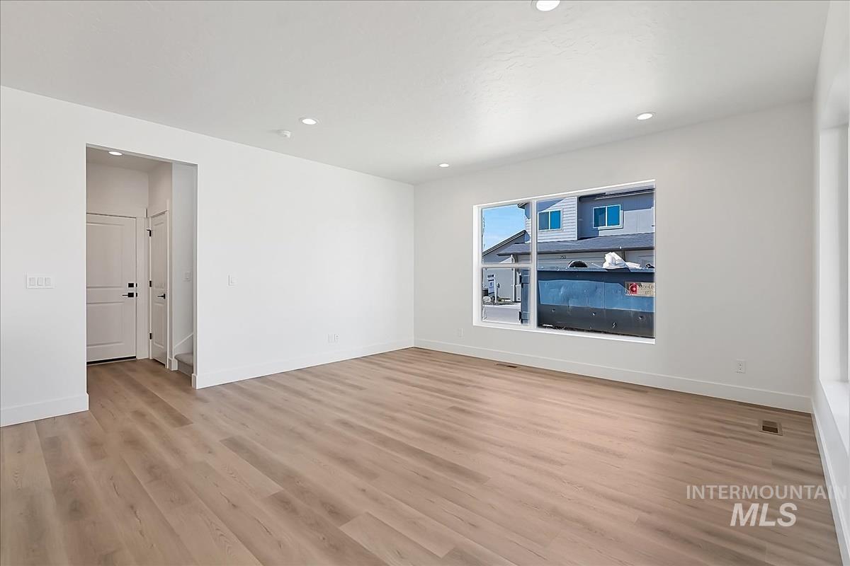 776 South Calhoun Lane Star, ID 83669 - Photo 22 of 49 Spacious room featuring light wood-finish flooring, white walls, and recessed lighting