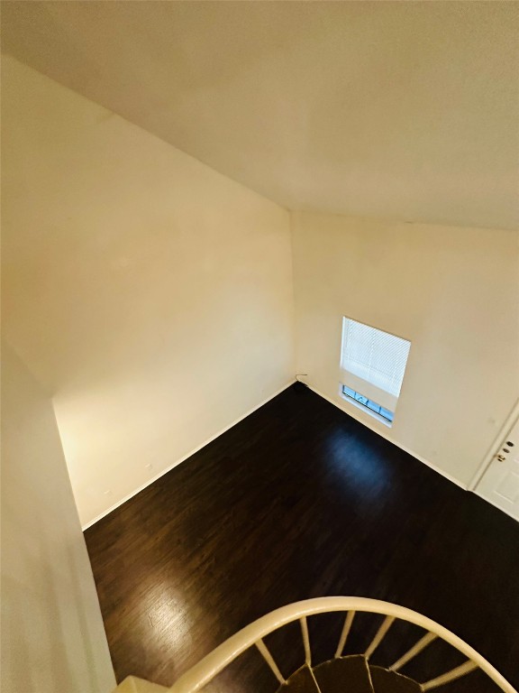 2401 Leon Street, Unit 307 Austin, TX 78705 - Photo 20 of 27 a black and white kitchen with a black wall