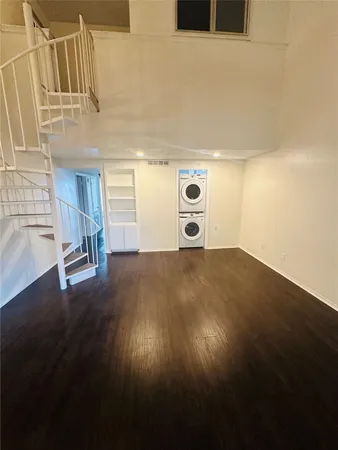a view of a livingroom with wooden floor
