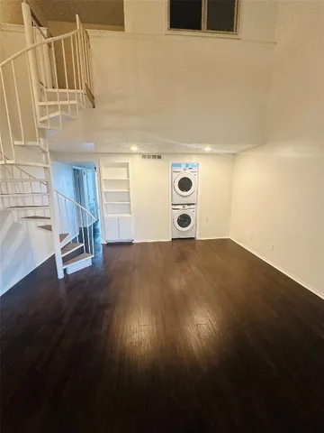 a view of a livingroom with wooden floor
