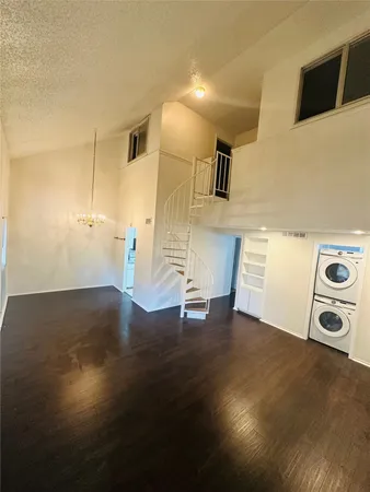 a view of a livingroom with wooden floor