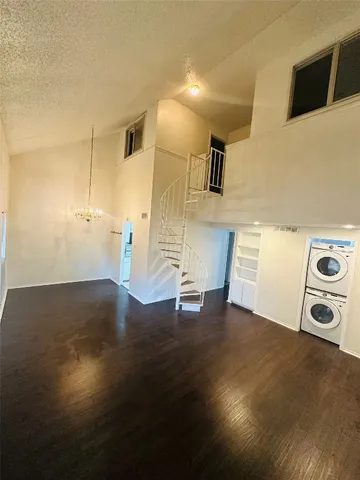 a view of a livingroom with wooden floor