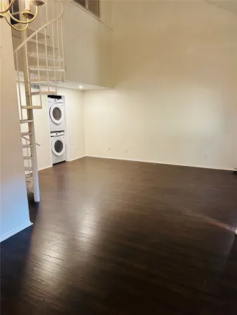 an empty room with wooden floor