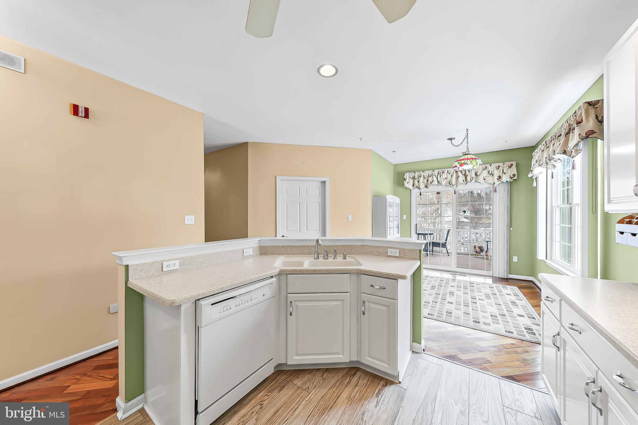 1299 Country Club Drive Springfield, PA 19064 - Photo 13 of 33 a kitchen with a sink stove and cabinets