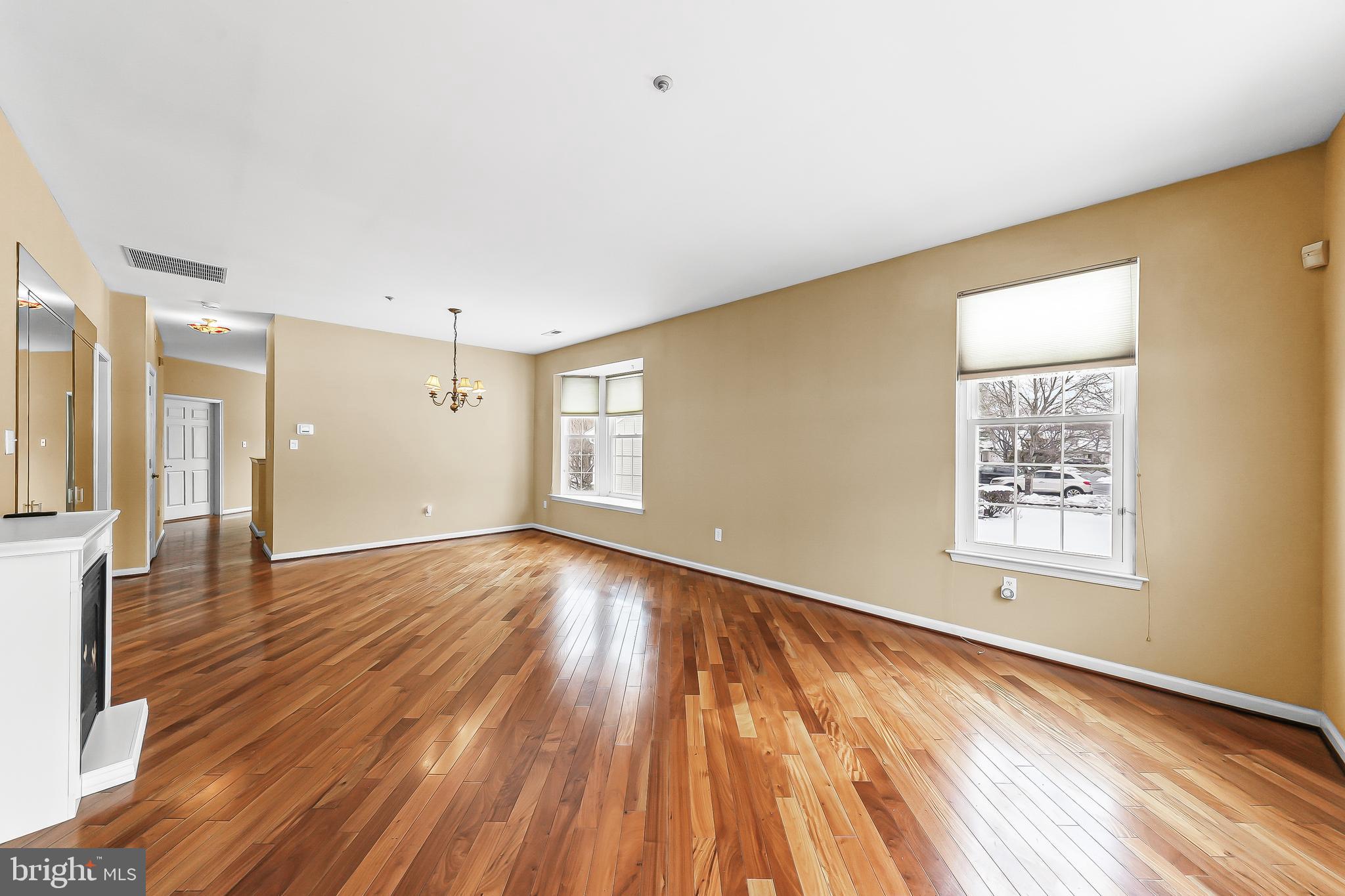 1299 Country Club Drive Springfield, PA 19064 - Photo 8 of 33 a view of an empty room with wooden floor and a window
