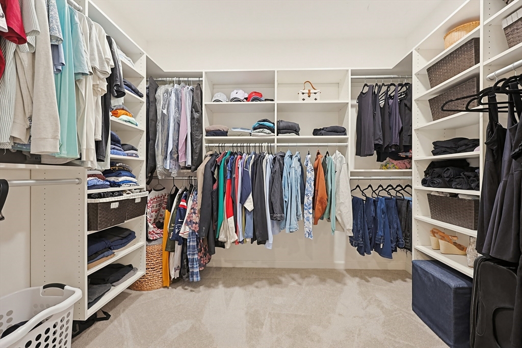 200 Revere Street, Unit 4209 Canton, MA 02021 - Photo 23 of 35 a view of walk in closet with clothes and shoes