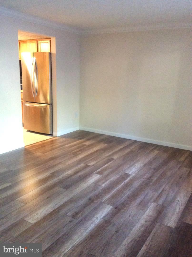 8338 Windfall Road Springfield, VA 22153 - Photo 6 of 28 Living Room with Hardwood Floors to Tiled Kitchen