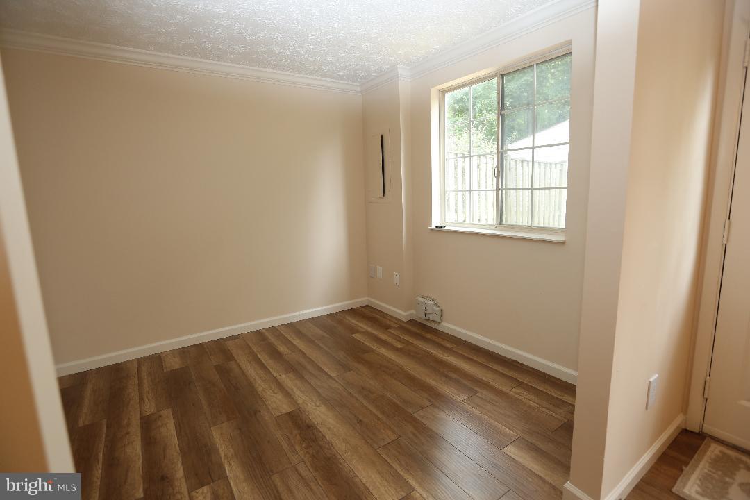 8338 Windfall Road Springfield, VA 22153 - Photo 10 of 28 Family Room with Hardwood Floors and view of Deck
