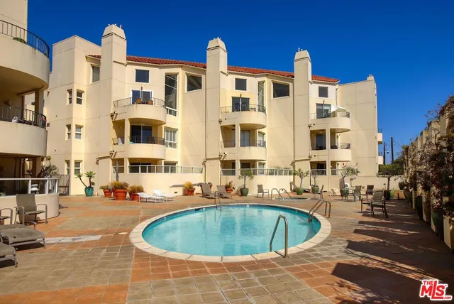 a view of a building with a swimming pool