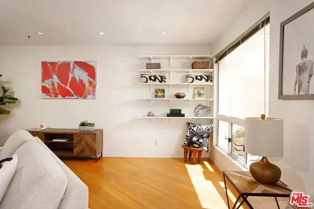 a bedroom with furniture and a book shelf