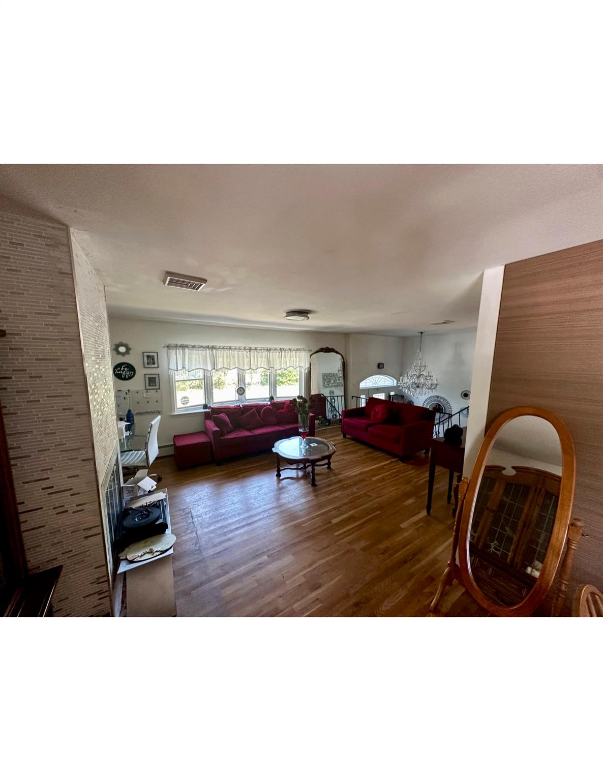 1300 Burlingham Road Pine Bush, NY 12566 - Photo 11 of 23 a living room with furniture and a wooden floor