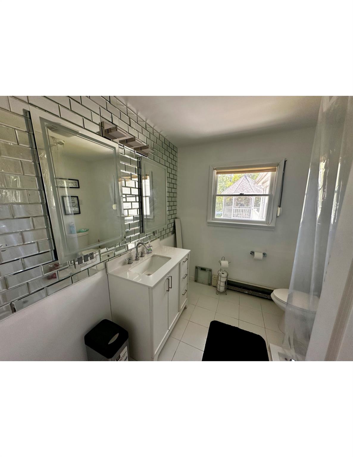 1300 Burlingham Road Pine Bush, NY 12566 - Photo 12 of 23 a bathroom with a sink a mirror and a bathtub