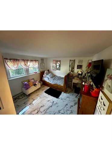 a outdoor living space with furniture and a flat screen tv