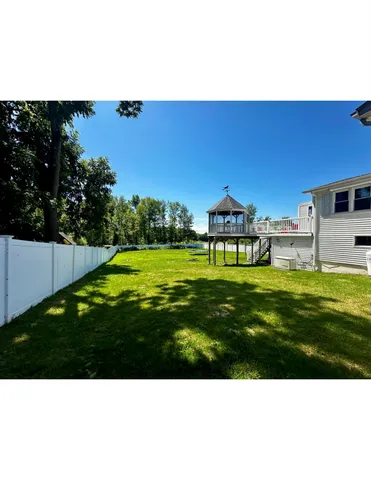 a view of a house with a big yard
