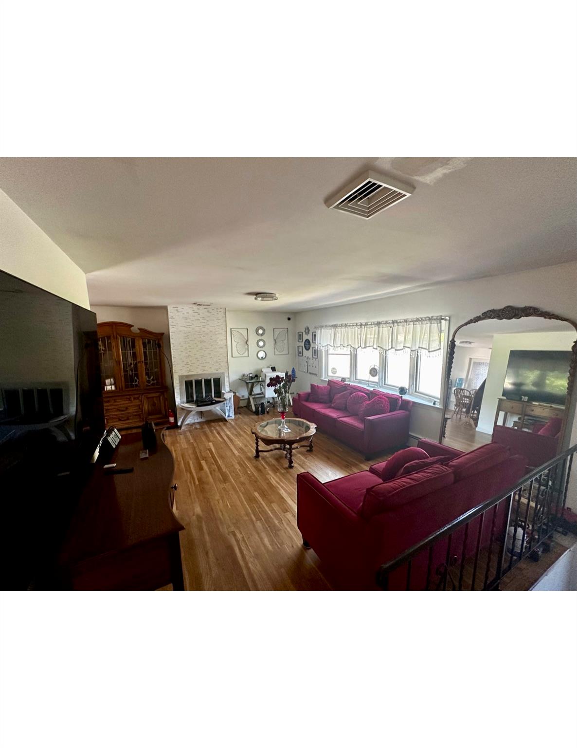 1300 Burlingham Road Pine Bush, NY 12566 - Photo 7 of 23 a living room with furniture a flat screen tv and a window