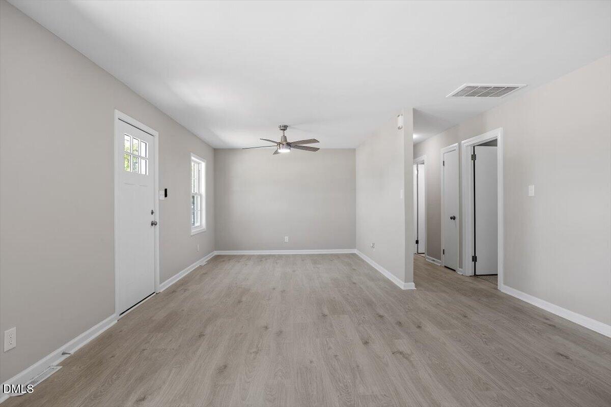 804 Little Rock Church Road Lucama, NC 27851 - Photo 11 of 28 an empty room with wooden floor