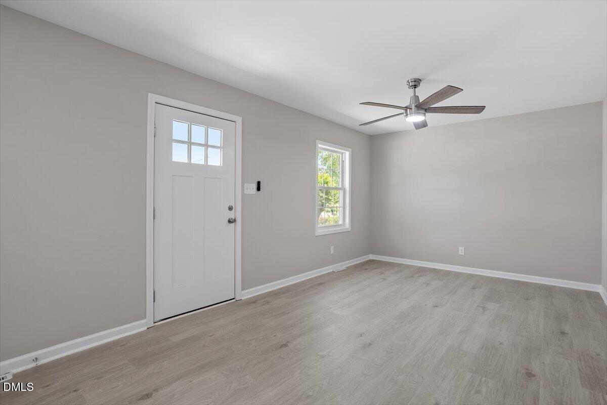 804 Little Rock Church Road Lucama, NC 27851 - Photo 13 of 28 an empty room with window and ceiling fan