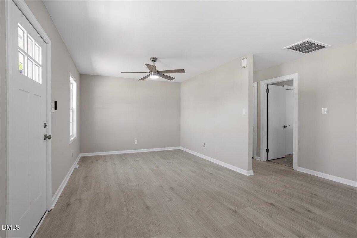 804 Little Rock Church Road Lucama, NC 27851 - Photo 15 of 28 a view of an empty room with wooden floor