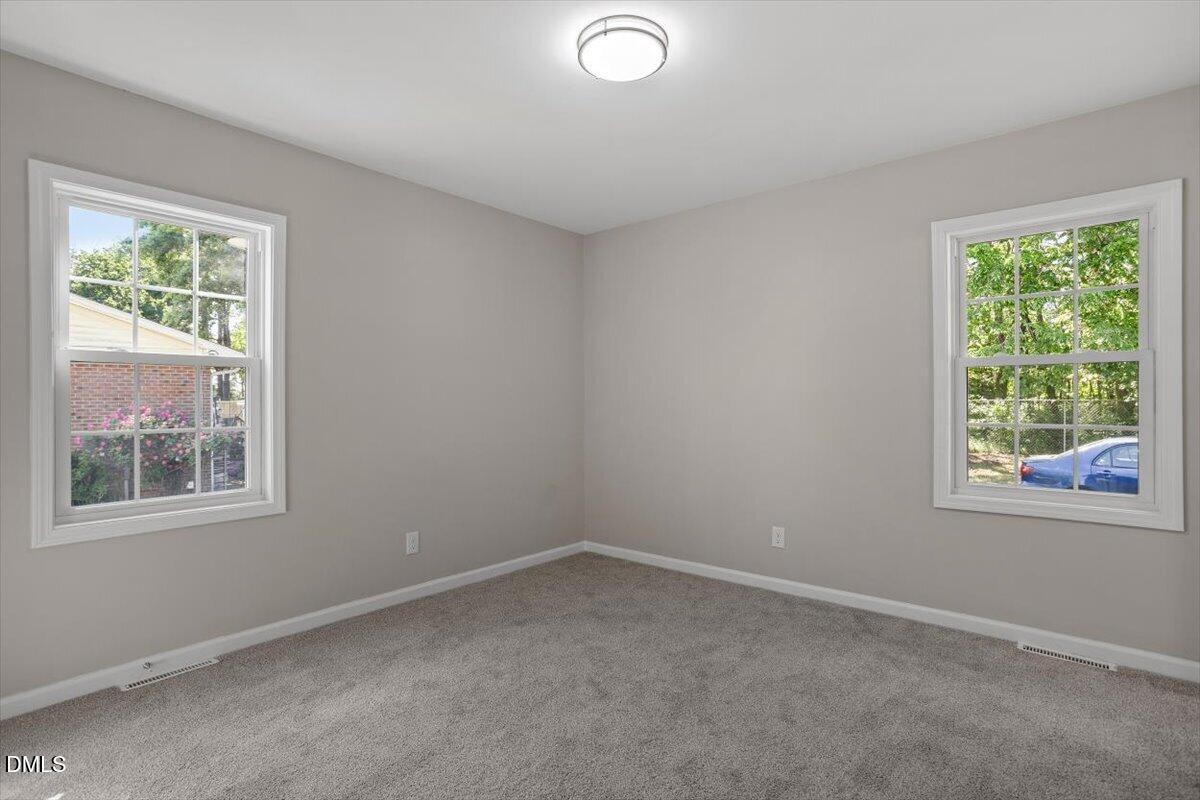 804 Little Rock Church Road Lucama, NC 27851 - Photo 18 of 28 an empty room with a window