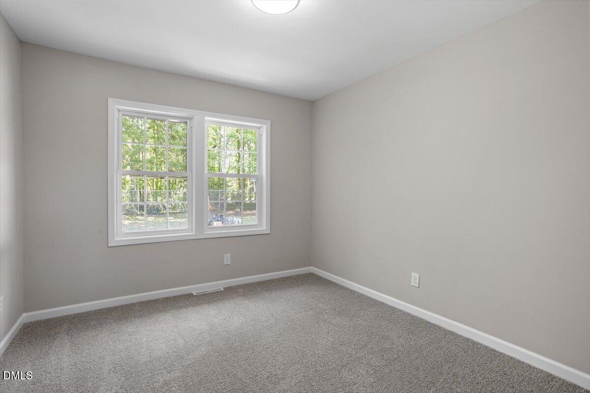 804 Little Rock Church Road Lucama, NC 27851 - Photo 22 of 28 an empty room with a window