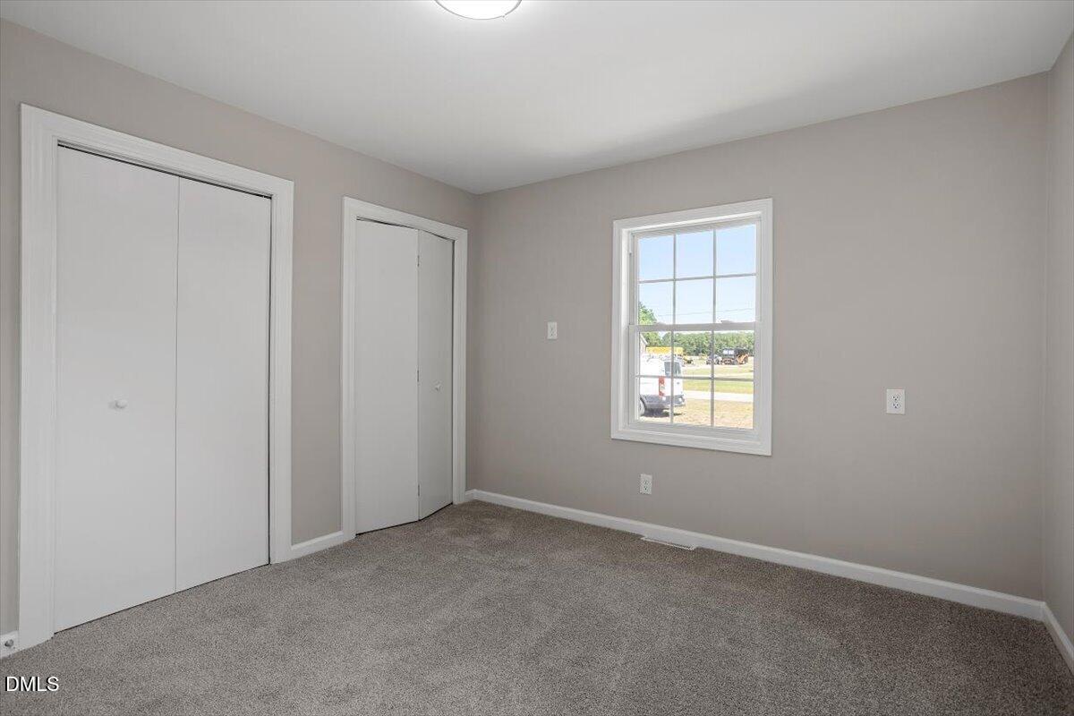 804 Little Rock Church Road Lucama, NC 27851 - Photo 24 of 28 an empty room with windows