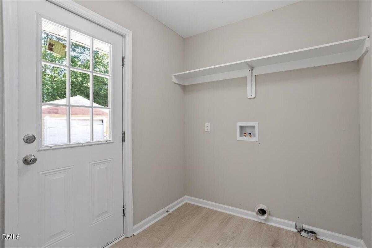 804 Little Rock Church Road Lucama, NC 27851 - Photo 25 of 28 a room with a window and a shower