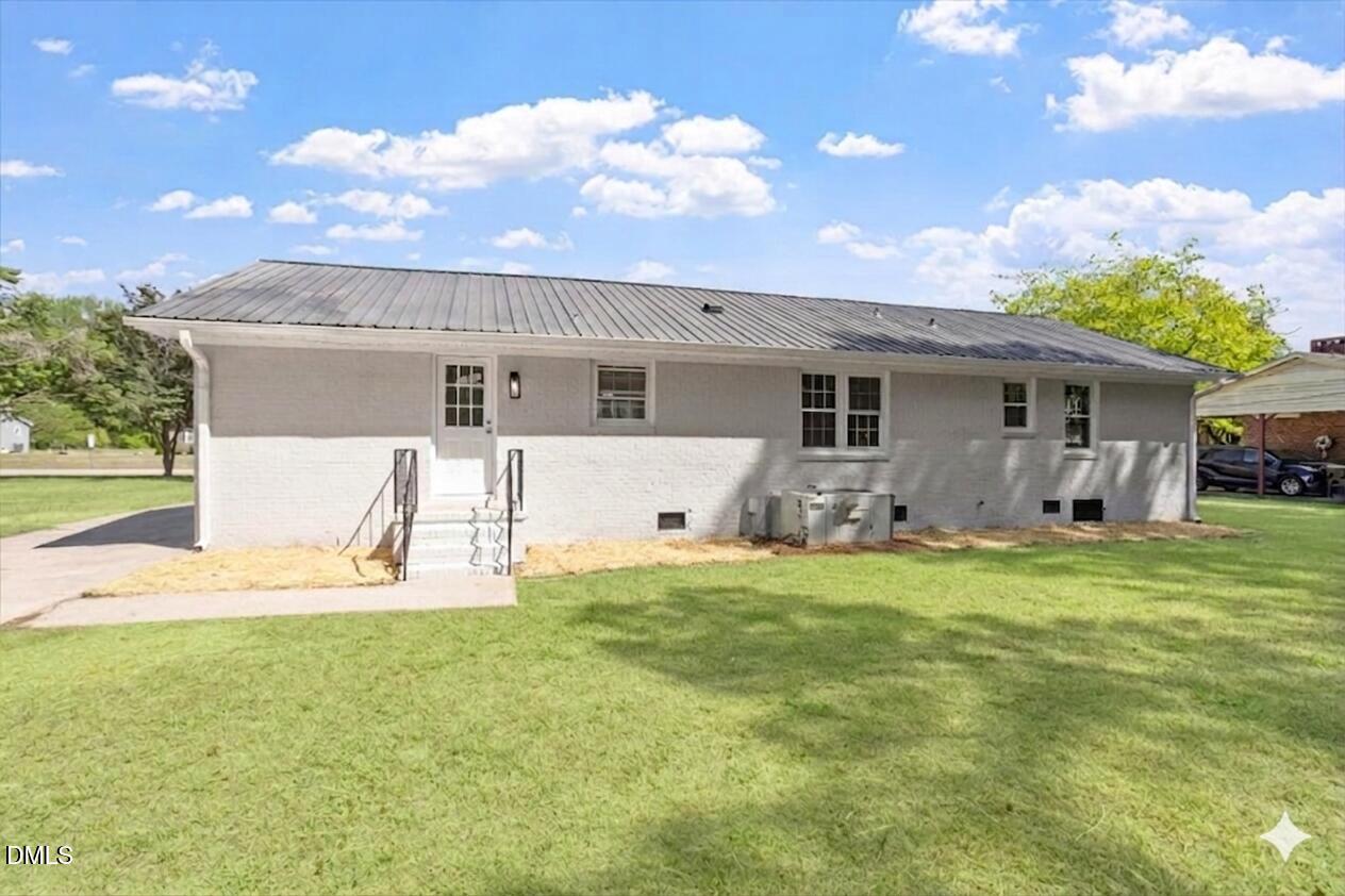 804 Little Rock Church Road Lucama, NC 27851 - Photo 26 of 28 a front view of house with yard and trees