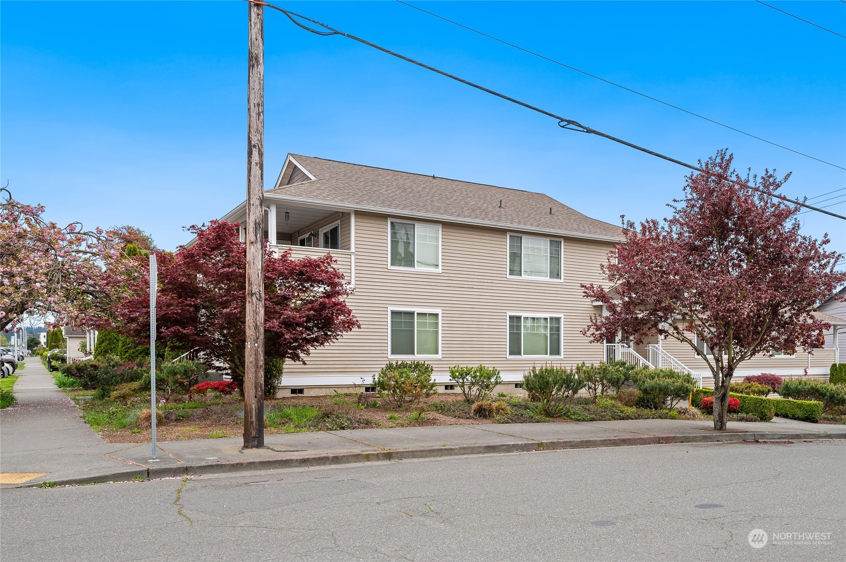 1516 33rd Street Everett, WA 98201 - Photo 2 of 9 a front view of a house with a garden and plants