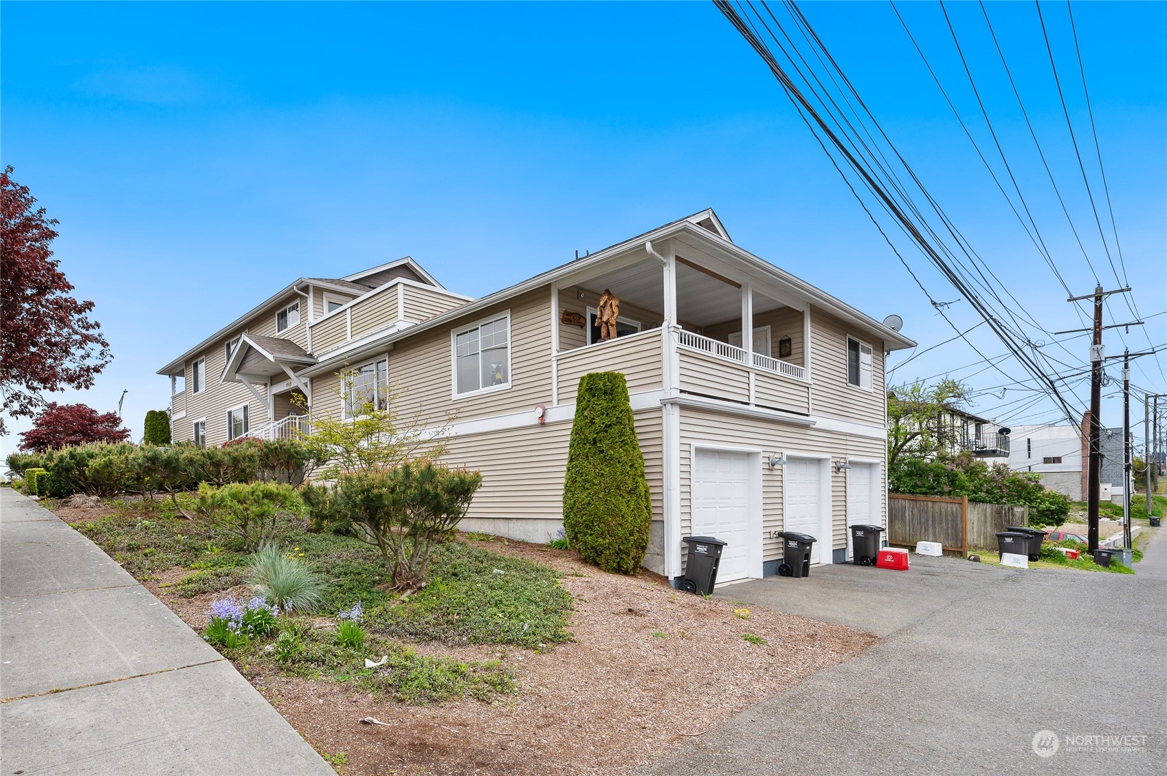 1516 33rd Street Everett, WA 98201 - Photo 8 of 9 a front view of a house with a yard and garage
