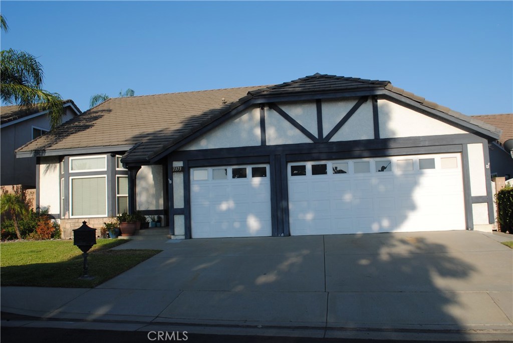 7373 Springmill Place Rancho Cucamonga, CA 91730 - Photo 1 of 1 a front view of a house with yard