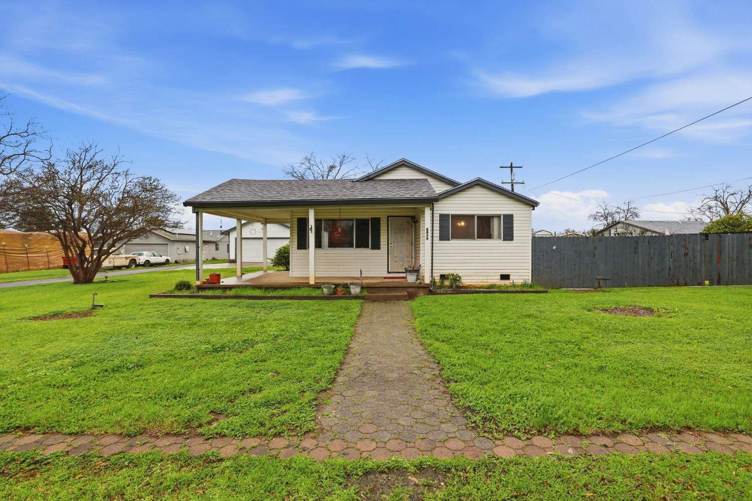 a front view of a house with a yard