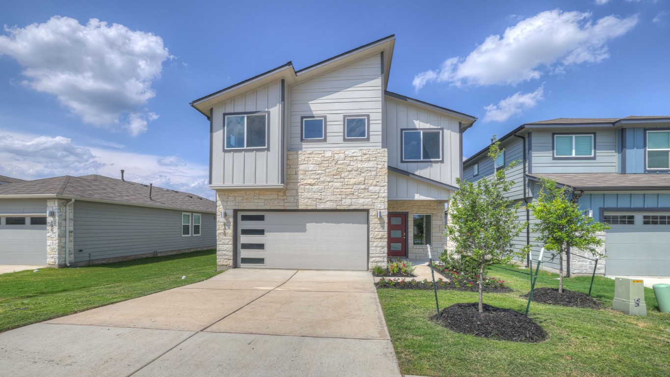 432 Wilshire Road San Marcos, TX 78666 - Photo 1 of 1 a front view of a house with a garden and plants