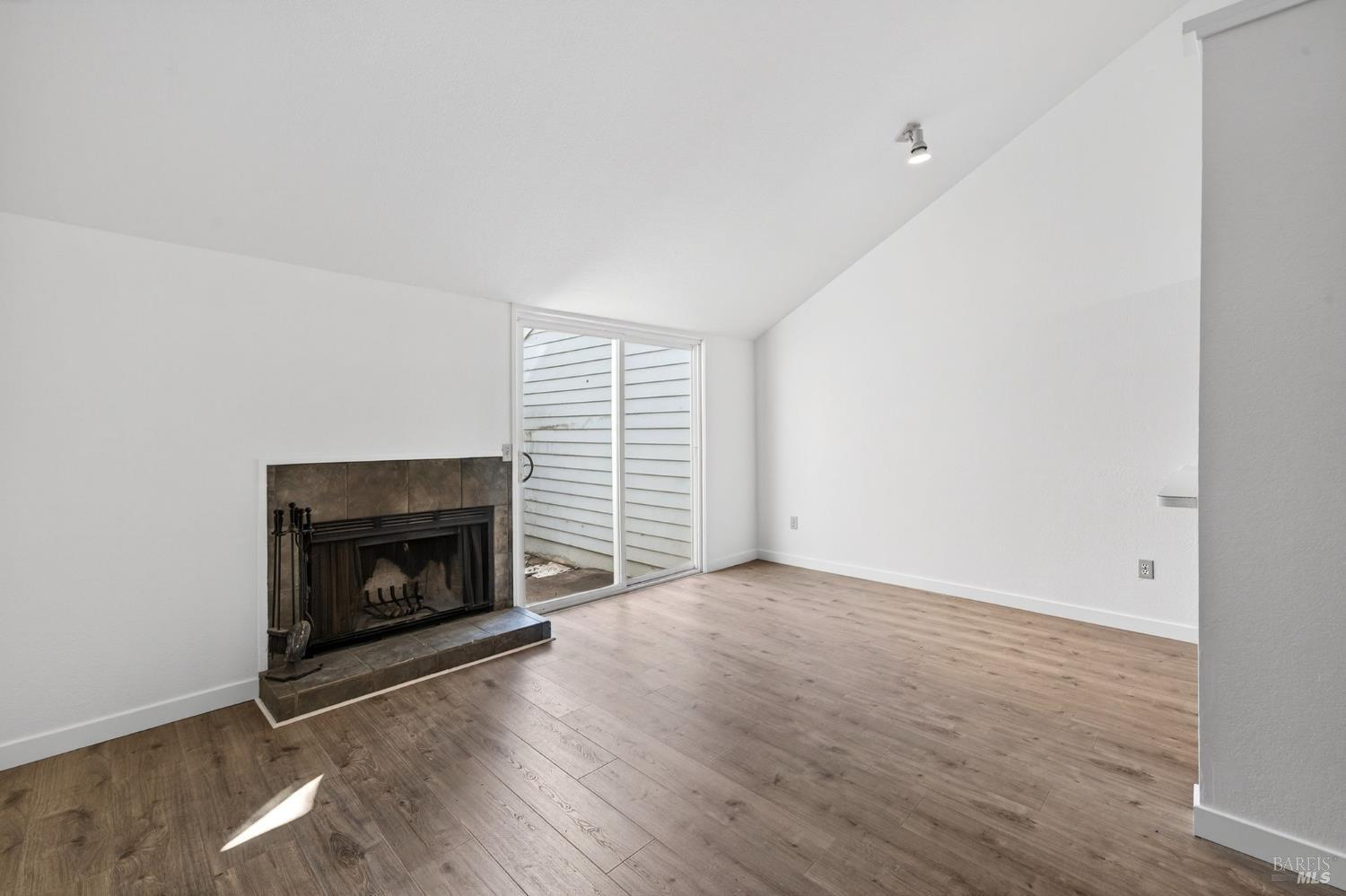 230 Courtyards East Windsor, CA 95492 - Photo 15 of 47 a view of empty room with a fireplace