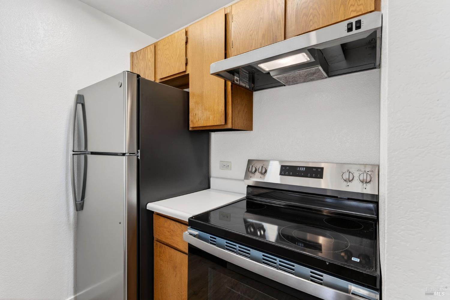 230 Courtyards East Windsor, CA 95492 - Photo 19 of 47 a kitchen with stainless steel appliances a refrigerator and a stove top oven