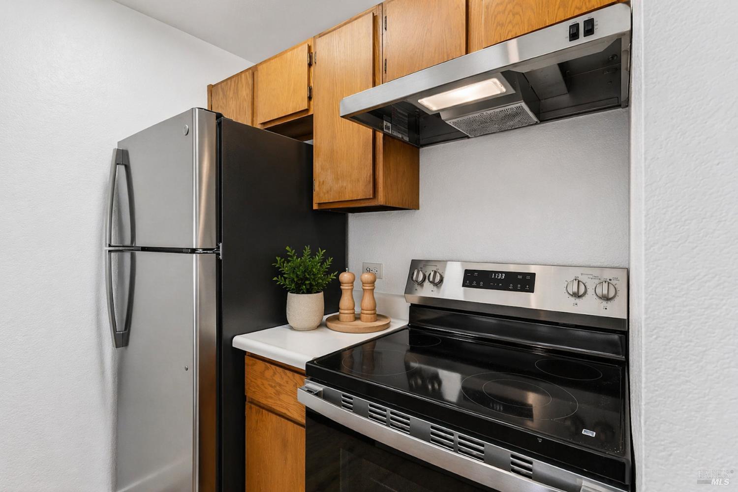 230 Courtyards East Windsor, CA 95492 - Photo 20 of 47 a kitchen with stainless steel appliances a refrigerator a stove and a microwave