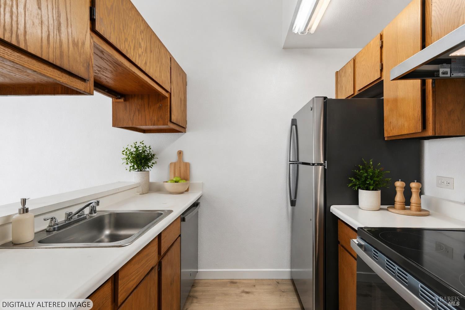 230 Courtyards East Windsor, CA 95492 - Photo 2 of 47 a kitchen with stainless steel appliances granite countertop a sink and a refrigerator