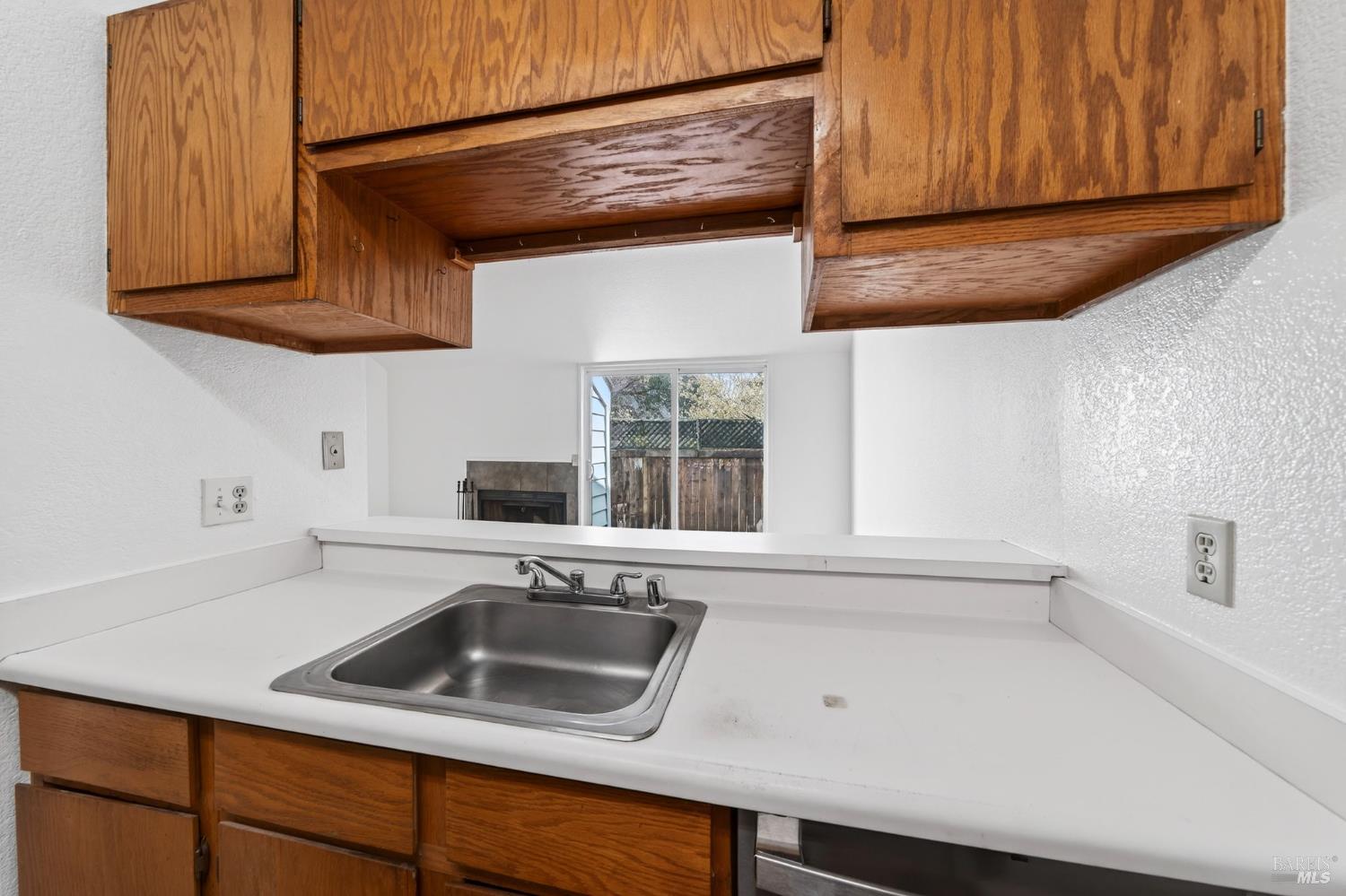 230 Courtyards East Windsor, CA 95492 - Photo 22 of 47 a kitchen with a sink cabinets and a window